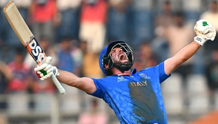 Italys Anthony Mosca celebrates after winning in the end of the 2026 ICC Mens T20 Cricket World Cup group stage match against Nepal at the Wankhede Stadium in Mumbai on February 12, 2026. — AFP