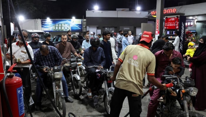 People wait for their turn to get fuel at a petrol station, amid the US and Israeli conflict in Iran, in Karachi, on March 6, 2026. — Reuters