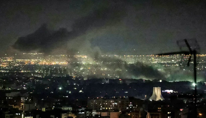 Smoke plumes billow from the site of airstrikes near Azadi Tower in western Tehran on March 10, 2026. — AFP