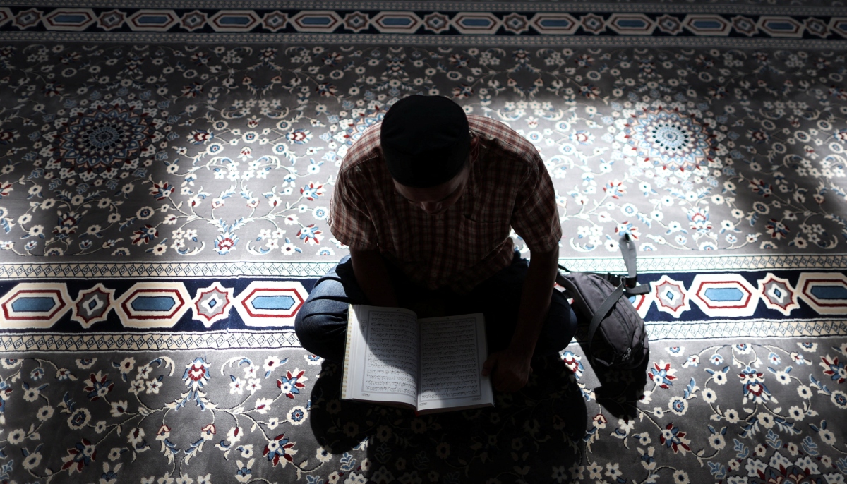 A Muslim man recites the Quran at a mosque during the holy month of Ramadan in Kuala Lumpur, Malaysia, March 5, 2026. — Reuters