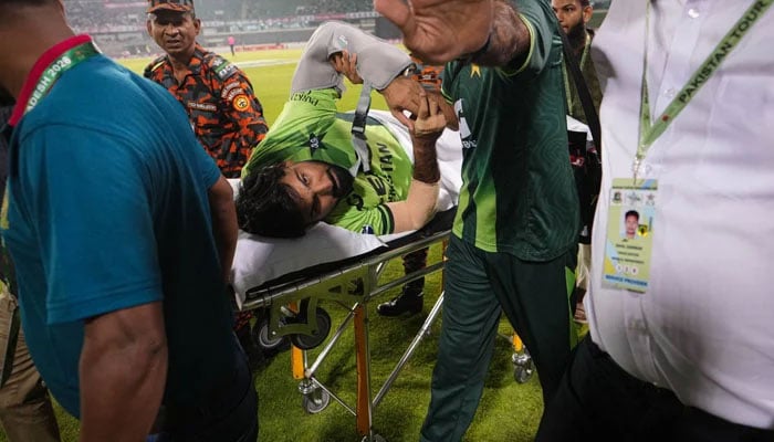 Pakistans Hussain Talat (centre) being stretchered off the field during their second ODI against Bangladesh at the Sher-e-Bangla National Cricket Stadium in Mirpur on March 13, 2026. — Reporter