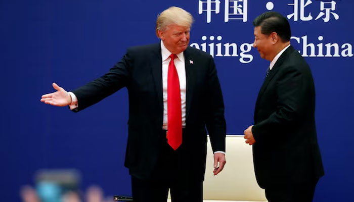 US President Donald Trump and Chinas Xi Jinping meet business leaders at the Great Hall of the People in Beijing, China. — Reuters/File