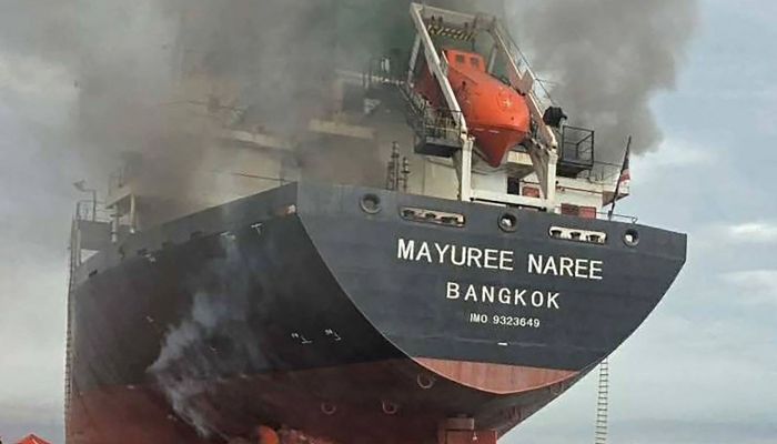 This handout photo taken on March 11, 2026 and released by the Royal Thai Navy shows smoke rising from the Thai bulk carrier Mayuree Naree near the Strait of Hormuz after an attack. — AFP