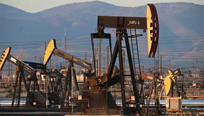 A drone view of a pump jack and drilling rig. — AFP/File