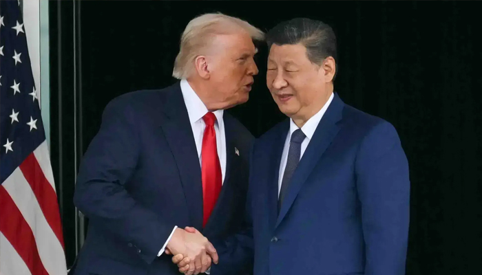 US President Donald Trump (left) and China’s President Xi Jinping shake hands as they leave after their talks at the Gimhae Air Base, located next to the Gimhae International Airport in Busan, October 30, 2025. — AFP/File