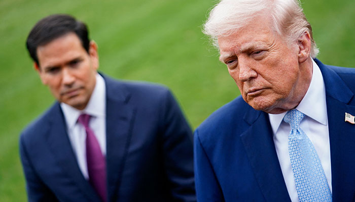 US President Donald Trump speaks to the media, flanked by US Secretary of State Marco Rubio, as he departs the White House for Florida, in Washington, D.C., US, March 20, 2026. — Reuters