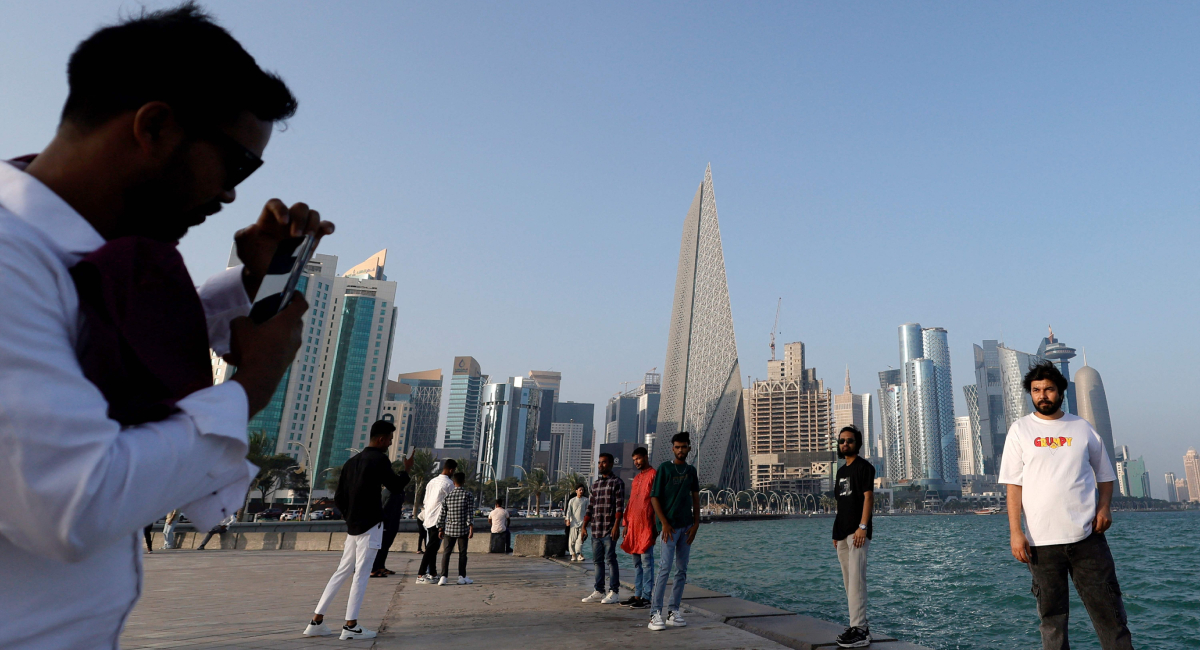 A man has his photograph taken as he poses along the Corniche on the second day of Eid ul Fitr celebrations, marking the end of the Muslim holy month of Ramadan, in Doha on March 21, 2026. — AFP