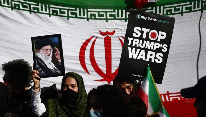 A picture of Irans former Supreme Leader Ali Khamenei is held during a protest march in central London on March 21, 2026, calling for the bombing of Iran to stop. — AFP