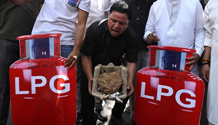 Indias Opposition Congress party workers stage a protest against the price hike and shortage of liquid petroleum gas (LPG) in New Delhi on March 13, 2026. — AFP