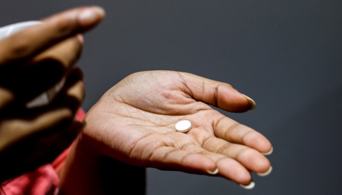 A patient prepares to take a pill at a clinic in Carbondale, Illinois, on 20 April 2023.— Reuters