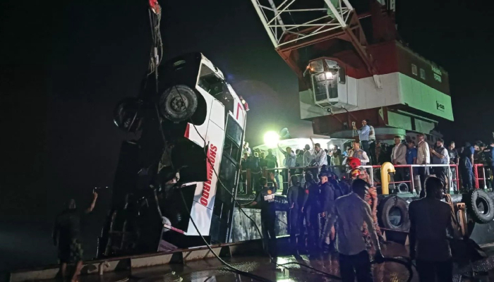 Rescue workers lift a bus from the Padma River with a crane after it plunged into Padma River in Rajshahi, Bangladesh, March 25, 2026. — X@DDNewslive