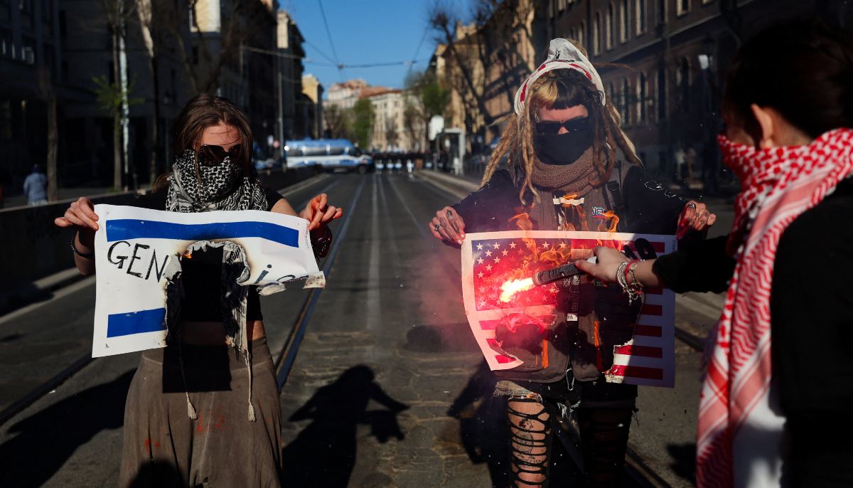 Demonstrators burn Israeli and US flags printed on paper during a national No Kings demonstration, part of a coordinated international mobilisation, amid heightened political tensions and following Prime Minister Giorgia Melonis recent referendum setback, in Rome, Italy, March 28, 2026. — Reuters