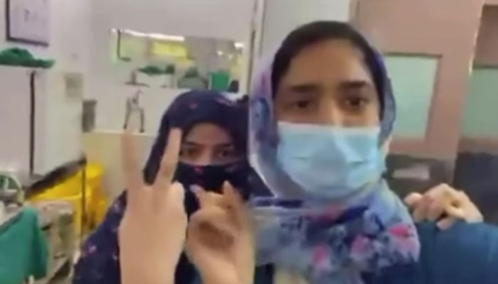 Screengrab from the viral video showing doctors performing the surgery and their colleagues recording the video. — Instagram/hidesidemagazine