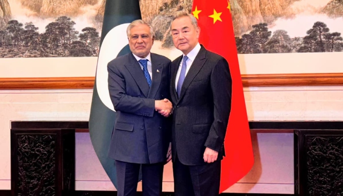 Deputy Prime Minister and Foreign Minister Ishaq Dar (left) and China’s Foreign Minister Wang Yi shake hands ahead of their meeting in Beijing, China, March 31, 2026. — X/@ForeignOfficePk