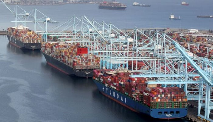 Shipping containers are unloaded from ships at a container terminal at the Port of Long Beach-Port of Los Angeles complex in Los Angeles, California, US, April 7, 2021.— Reuters