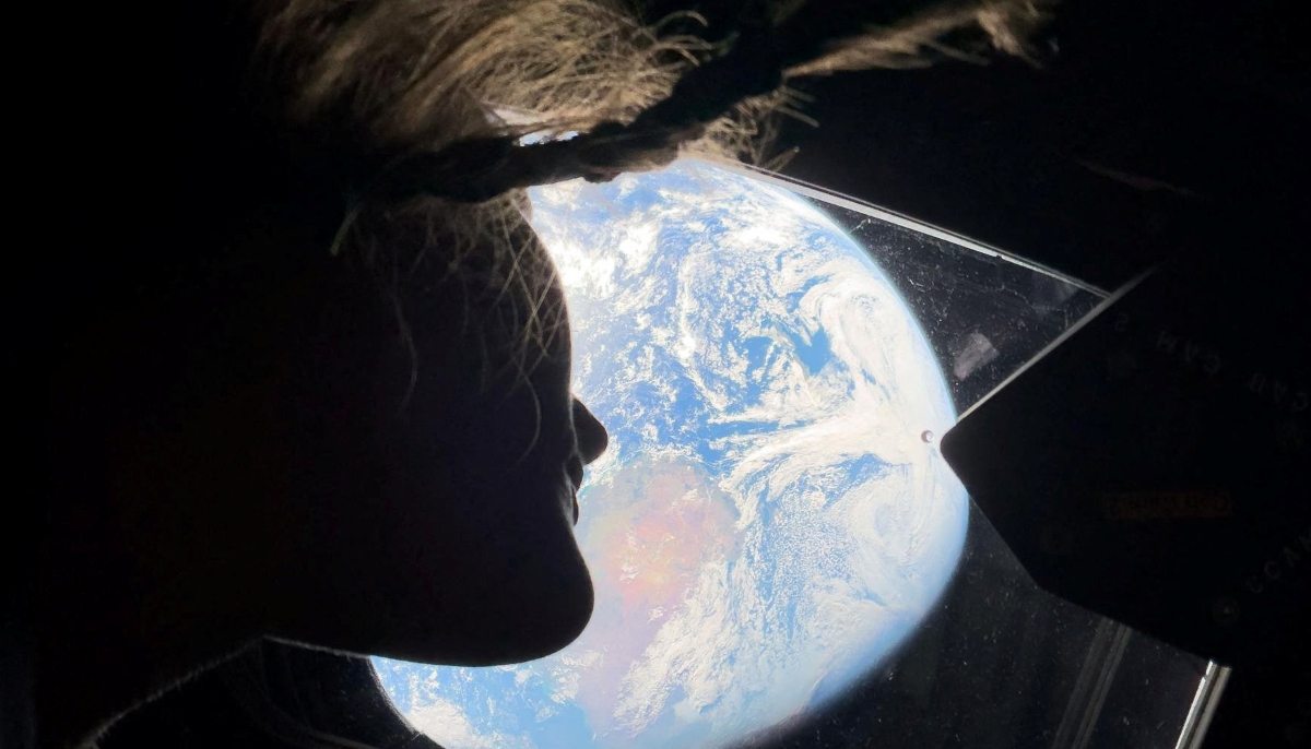 Nasa astronaut and Artemis II mission specialist Christina Koch peers out of one of the Orion spacecrafts main cabin windows, looking back at Earth, as the crew travels towards the moon April 2, 2024. — Reuters