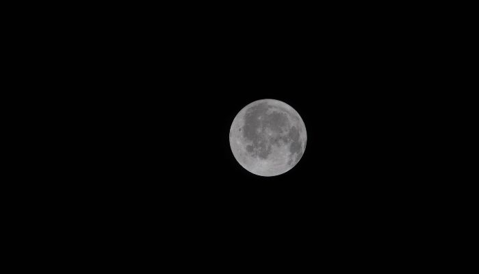 This handout picture provided by Nasa shows the Moon taken by an Artemis II crewmember through the window of the Orion spacecraft on April 3, 2026. — AFP