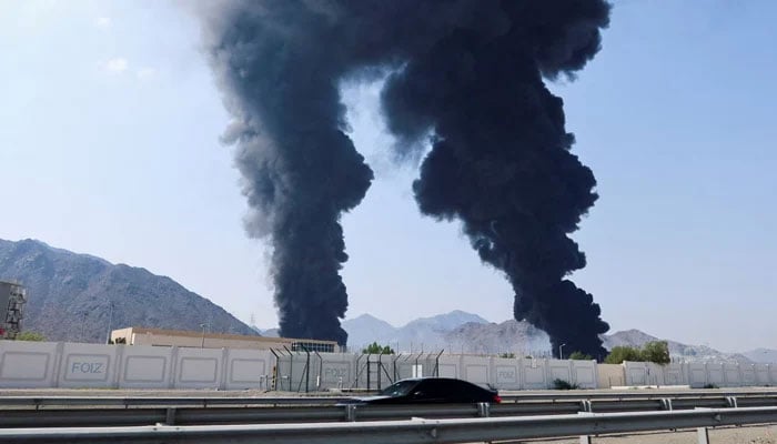 This representational image shows smoke rises in the Fujairah oil industry zone, caused by debris after interception of a drone by air defences in Fujairah, United Arab Emirates, March 14, 2026. — Reuters