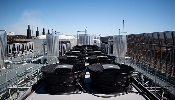 This photograph taken on July 8, 2020 shows cooler installations on the roof of the new MRS3 Interxion datacentre, in Marseille harbour, southern France. — AFP