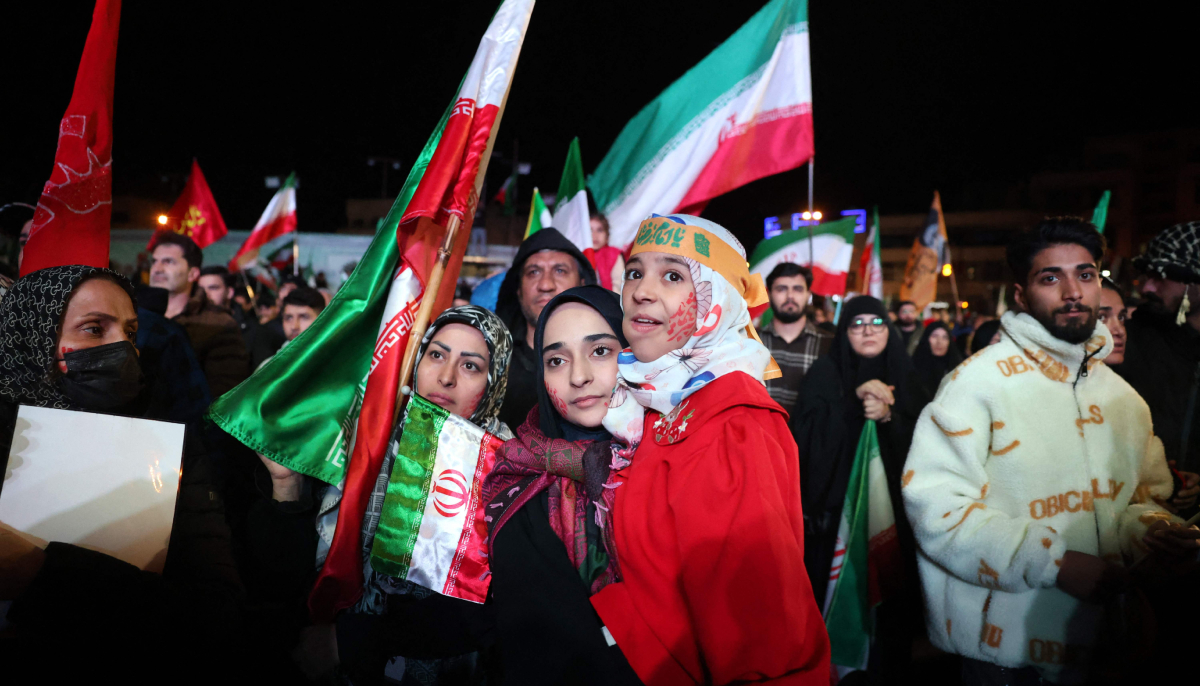 Iranians react after a ceasefire announcement at the Enqelab square, in Tehran, on April 8 2026. — AFP