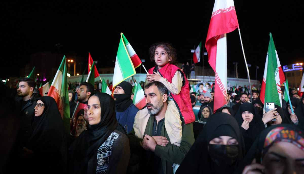 Iranians react after a ceasefire announcement at the Enqelab square, in Tehran, on April 8 2026. — AFP