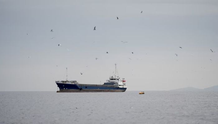 A vessel at the Strait of Hormuz, off the coast of Oman’s Musandam province, April 12, 2026. — Reuters