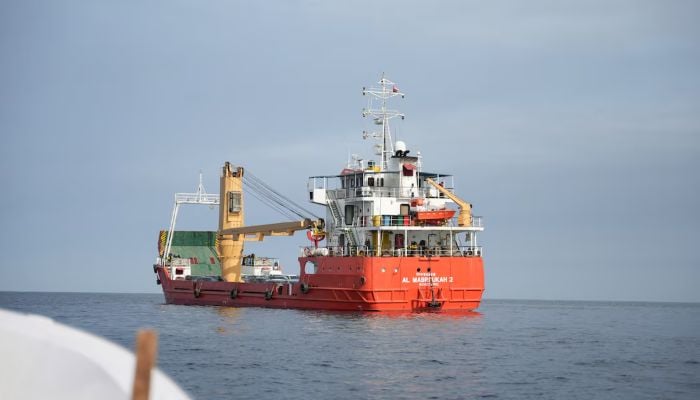 A vessel at the Strait of Hormuz, off the coast of Oman’s Musandam province, April 12, 2026. — Reuters