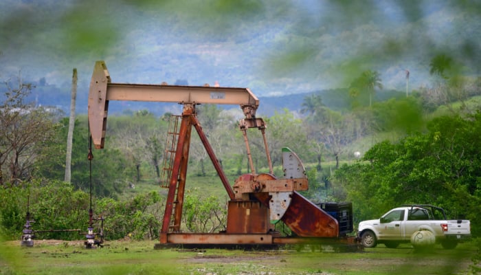 A pump jack operates at an oil well run by Mexican state oil firm Pemex, where Indigenous communities in the Papantla region sit atop gas and oil deposits the government wants to exploit using hydraulic fracturing, or fracking, in Arroyo Florido, Veracruz state, Mexico, April 10, 2026. — Reuters