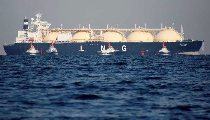 A liquefied natural gas (LNG) tanker is tugged towards a thermal power station in Futtsu, east of Tokyo, Japan on November 13, 2017. — Reuters