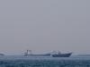 Oil prices dip, most stocks rise on lingering Iran peace hopes