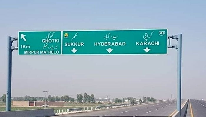 This undated image shows a road sign on the M5 Motorway directs traffic towards Ghotki, Sukkur, Hyderabad and Karachi. — @developingpak