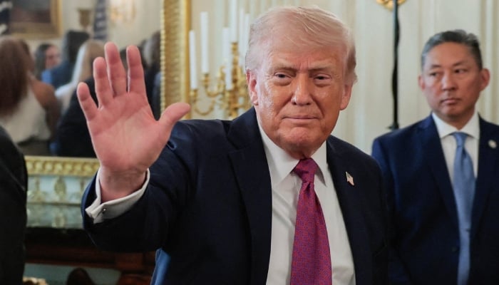 US President Donald Trump waves as he departs after delivering remarks to NCAA Collegiate National Champions in the State Dining Room at the White House in Washington, DC, US, April 21, 2026. — Reuters