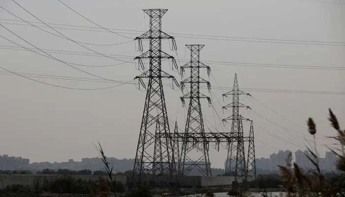 A power transmission tower is seen a day after a country-wide power breakdown in Karachi on January 24, 2023. — Reuters