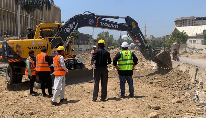 A view of the development work of Red Line underway with the help of heavy machinery at University Road in Karachi, April 26, 2026. — X/@murtazawahab1