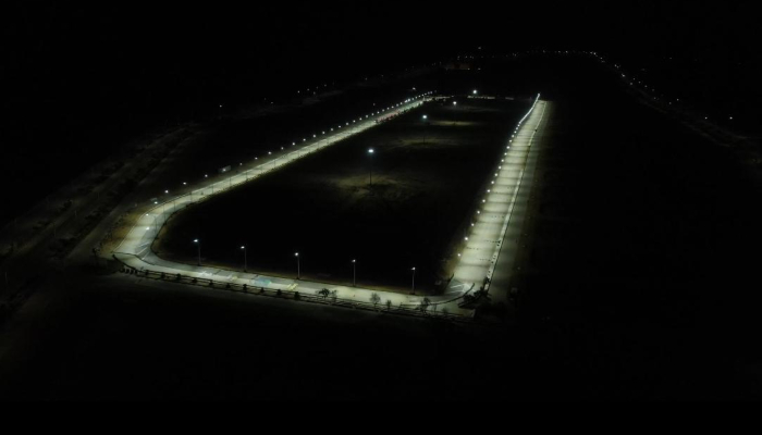 An aerial view shows a floodlit racetrack prepared for night motorsports events in Karachi. — Reporter