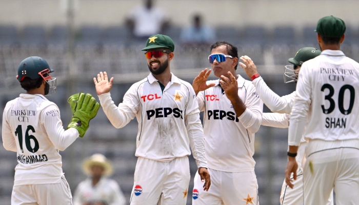 Pakistani players celebrate after taking a wicket during the fifth day of the first Test cricket match between Bangladesh and Pakistan at the Sher-e-Bangla National Stadium in Mirpur on May 12, 2026. — AFP