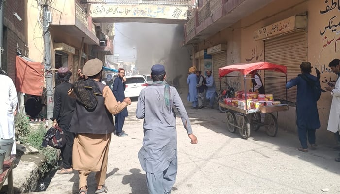 Residents gather at the site of a blast in Wana, South Waziristan, on May 18, 2026. — Reporter