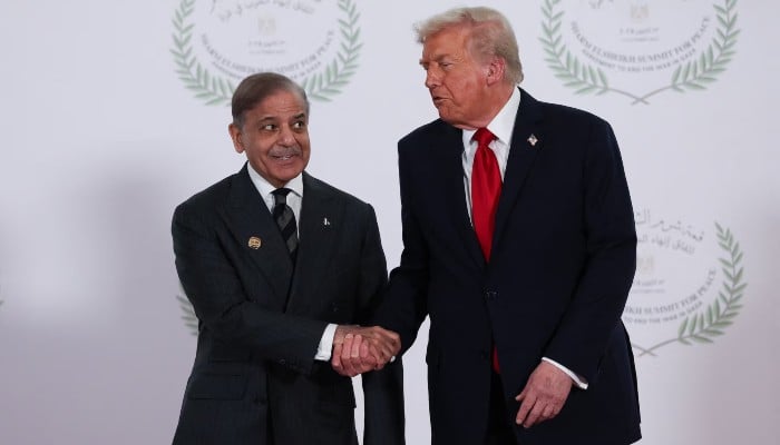 Prime Minister Shehbaz Sharif and US President Donald Trump shake hands as they pose for a photo at a world leaders summit on ending the Gaza war, in Sharm el-Sheikh, Egypt, October 13, 2025. — Reuters