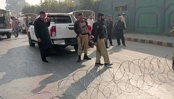 Policemen guard outside CTD police station in Peshawar on November 2, 2025. — Geo News