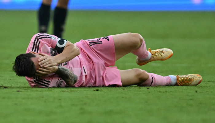 Lionel Messi reacts during a football match. — AFP