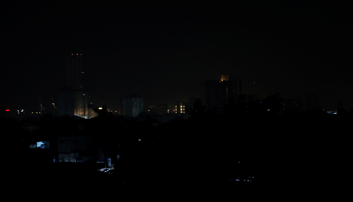 A view shows buildings during a power breakdown in Karachi. — Reuters
