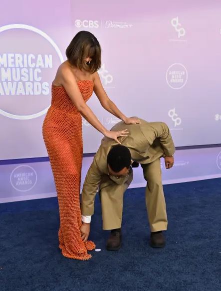 John Legend steps in as Chrissy Teigen suffers wardrobe malfunction at AMAs