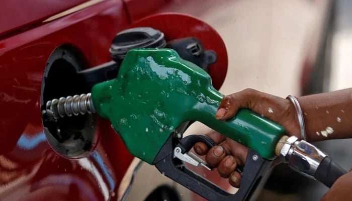 A representational image of a person filling petrol in a car. — Reuters/File