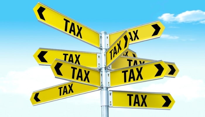 (Representational image) Multiple tax signs can be seen on a pole. — Canva