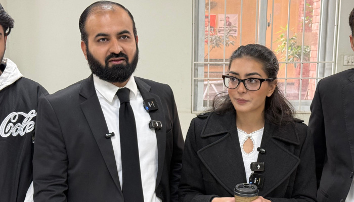 Human rights lawyer Imaan Mazari (right) with her husband and fellow lawyer Hadi Ali Chattha (left), during a court hearing in Islamabad, on December 5, 2025. — AFP