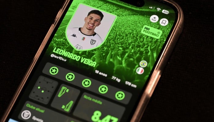Brazilian football player Leonardo Veiga, 18, is seen on the screen of the Foot Bao app, in Sao Paulo, Brazil. — AFP