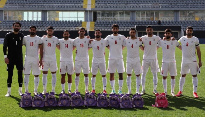 Iran football team players line up before the International Friendly match  as school bags are laid in memory of the victims of the girls school bombing in Minab, Iran at Mardan Sports Complex, Antalya, Turkey, March 27, 2026. — Reuters