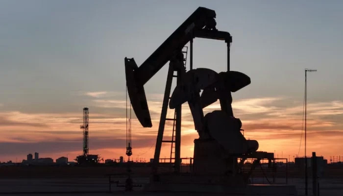 A drone view of a pump jack and drilling rig south of Midland, Texas, United States. — Reuters/File