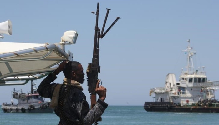 A maritime policeman on a tag-boat guards oil tanker Aris-13, which was released by pirates, as it sails to dock on the shores of the Gulf of Aden in the city of Bosasso, northern Somalias semi-autonomous region of Puntland, March 19, 2017. — Reuters