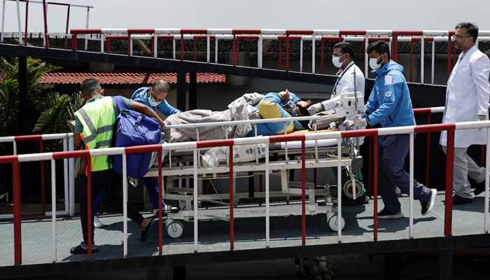 Paramedics transport Dawa Sherpa, who was missing for several days in the Everest region, from the helipad at HAMS Hospital in Kathmandu, Nepal, June 4, 2026.— Reuters/File